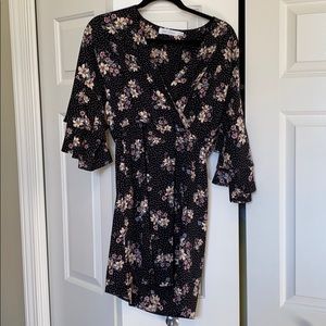 Faux wrap dress with flounce sleeves.